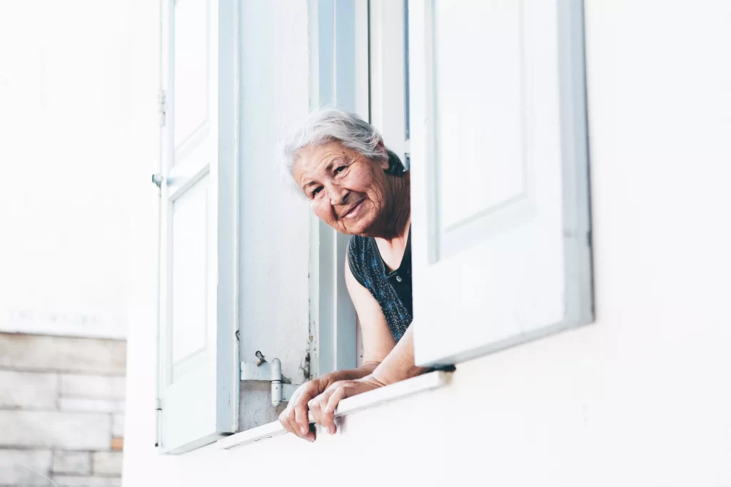 An old woman peeping at window