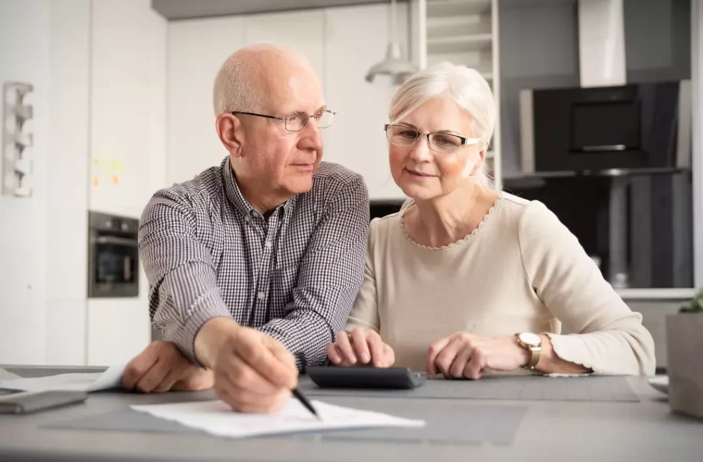 Senior couple discussing about their aged care plan